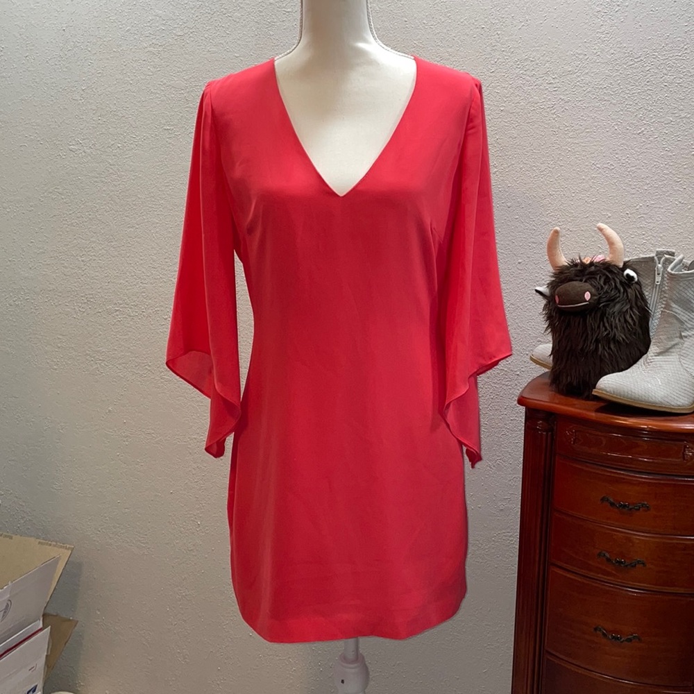 Stunning coral BCBG dress flowing bell sleeves and amazing low cut strappy back